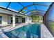 Inviting pool and spa with screened enclosure and patio at 112 Northshore Ter, Punta Gorda, FL 33980