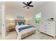 Bedroom with white dresser and ceiling fan at 116 Northshore Ter, Punta Gorda, FL 33980