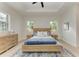 Light and airy bedroom with wood bed frame and plenty of natural light at 116 Northshore Ter, Punta Gorda, FL 33980