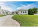New construction home with driveway and landscaped lawn at 116 Northshore Ter, Punta Gorda, FL 33980