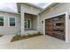 Front view of home with modern garage door and landscaping at 116 Northshore Ter, Punta Gorda, FL 33980