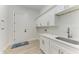 Laundry room with white cabinets and countertop at 116 Northshore Ter, Punta Gorda, FL 33980