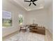 Bright home office with wood desk and ceiling fan at 116 Northshore Ter, Punta Gorda, FL 33980