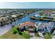 Luxury waterfront home with private dock, solar panels, and expansive canal views at 1245 Whippoorwill Ct, Punta Gorda, FL 33950