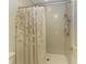 Clean bathroom with a shower and a decorative shower curtain at 1245 Whippoorwill Ct, Punta Gorda, FL 33950