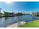 Relaxing canal view with seating area on dock at 1245 Whippoorwill Ct, Punta Gorda, FL 33950