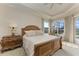 Bright and airy main bedroom with views, and elegant furnishings at 1245 Whippoorwill Ct, Punta Gorda, FL 33950