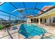 Enjoy this amazing pool area and spa with water views! at 1245 Whippoorwill Ct, Punta Gorda, FL 33950