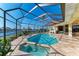 Enclosed pool and spa with stunning water views at 1245 Whippoorwill Ct, Punta Gorda, FL 33950