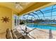 Relaxing pool area with screened enclosure, offering water views at 1245 Whippoorwill Ct, Punta Gorda, FL 33950