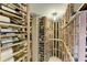 Spectacular wine cellar with numerous bottles and wooden racks at 1245 Whippoorwill Ct, Punta Gorda, FL 33950