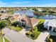 Aerial view of single-Gathering home with lake access and community at 13761 Long Lake Ln, Port Charlotte, FL 33953