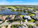 Aerial view of luxury homes situated on a lakefront at 13761 Long Lake Ln, Port Charlotte, FL 33953