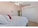 Bright bedroom with a queen-size bed and a large closet at 13761 Long Lake Ln, Port Charlotte, FL 33953