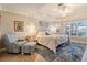 Main bedroom with a ceiling fan and large windows at 13761 Long Lake Ln, Port Charlotte, FL 33953