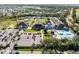 Aerial view of community center, pool, and parking at 13761 Long Lake Ln, Port Charlotte, FL 33953