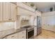 Stainless steel appliances and white cabinets in kitchen at 13761 Long Lake Ln, Port Charlotte, FL 33953