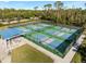 Community pickleball courts with shaded seating area at 13761 Long Lake Ln, Port Charlotte, FL 33953