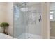 Large walk-in shower with herringbone tile and glass enclosure at 13761 Long Lake Ln, Port Charlotte, FL 33953