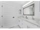 Modern bathroom with double sinks and white cabinetry at 1425 Park Beach Cir # 124, Punta Gorda, FL 33950