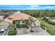 Aerial view of property showing house, driveway, and landscaping at 1531 Aqui Esta Dr # 1, Punta Gorda, FL 33950