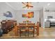 Elegant dining room with wood table and chairs, ready to host at 1531 Aqui Esta Dr # 1, Punta Gorda, FL 33950