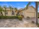 Beautiful stucco home with lush landscaping and a paved driveway at 1531 Aqui Esta Dr # 1, Punta Gorda, FL 33950