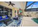 Covered patio boasts seating, dining, and pool access at 1531 Aqui Esta Dr # 1, Punta Gorda, FL 33950