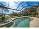 Inviting pool with spa and serene water views at 1531 Aqui Esta Dr # 1, Punta Gorda, FL 33950