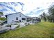 Modern farmhouse exterior with a large yard at 1573 Faraday St, Port Charlotte, FL 33952