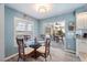 Dining area with glass table, wicker chairs, and view of patio at 16253 Cape Horn Blvd, Punta Gorda, FL 33955