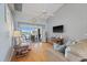 Living room with vaulted ceiling, hardwood floors, and canal view at 16253 Cape Horn Blvd, Punta Gorda, FL 33955