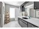 Bathroom with black sink, patterned wallpaper, and a window at 1640 Montia Ct, Punta Gorda, FL 33950