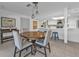 Dining area with a round wooden table and kitchen views at 1640 Montia Ct, Punta Gorda, FL 33950