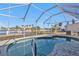 Enjoy this beautiful screened-in pool with stunning water views at 1640 Montia Ct, Punta Gorda, FL 33950