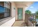 Private balcony with teal door access to condo at 175 Kings Hwy # 738, Punta Gorda, FL 33983