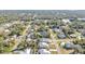 Aerial view showing houses, roads, and green spaces in a residential area at 18266 Grace Ave, Port Charlotte, FL 33948