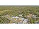 Aerial view of residential neighborhood with houses and trees at 18266 Grace Ave, Port Charlotte, FL 33948