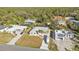 Aerial view of homes, driveways, and lush green surroundings at 18266 Grace Ave, Port Charlotte, FL 33948