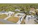 Aerial view showcasing a neighborhood with houses and pools at 18266 Grace Ave, Port Charlotte, FL 33948