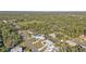 Aerial view of residential neighborhood with houses and trees at 18266 Grace Ave, Port Charlotte, FL 33948