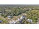 Aerial view showing neighborhood homes and lush green surroundings at 18266 Grace Ave, Port Charlotte, FL 33948