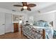 Spacious bedroom with a king-size bed and ceiling fan at 18266 Grace Ave, Port Charlotte, FL 33948