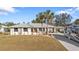 Single-story home with RV parking and palm trees at 18266 Grace Ave, Port Charlotte, FL 33948