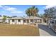 Single-Gathering home exterior with palm trees and RV at 18266 Grace Ave, Port Charlotte, FL 33948