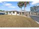 Single story home with palm trees at 18266 Grace Ave, Port Charlotte, FL 33948