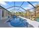 Inviting screened pool with plenty of space for lounging and entertaining at 18266 Grace Ave, Port Charlotte, FL 33948