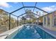 Inviting screened pool area with spacious deck at 18266 Grace Ave, Port Charlotte, FL 33948