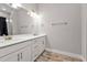 Double vanity bathroom with white cabinets and gold fixtures at 18322 Garman Ave, Port Charlotte, FL 33948