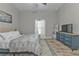 Comfortable bedroom with a king-size bed and a navy blue dresser at 18322 Garman Ave, Port Charlotte, FL 33948